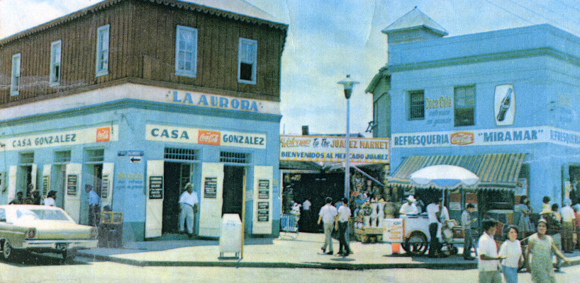 1960's image of a market in Mexico with blue buildings