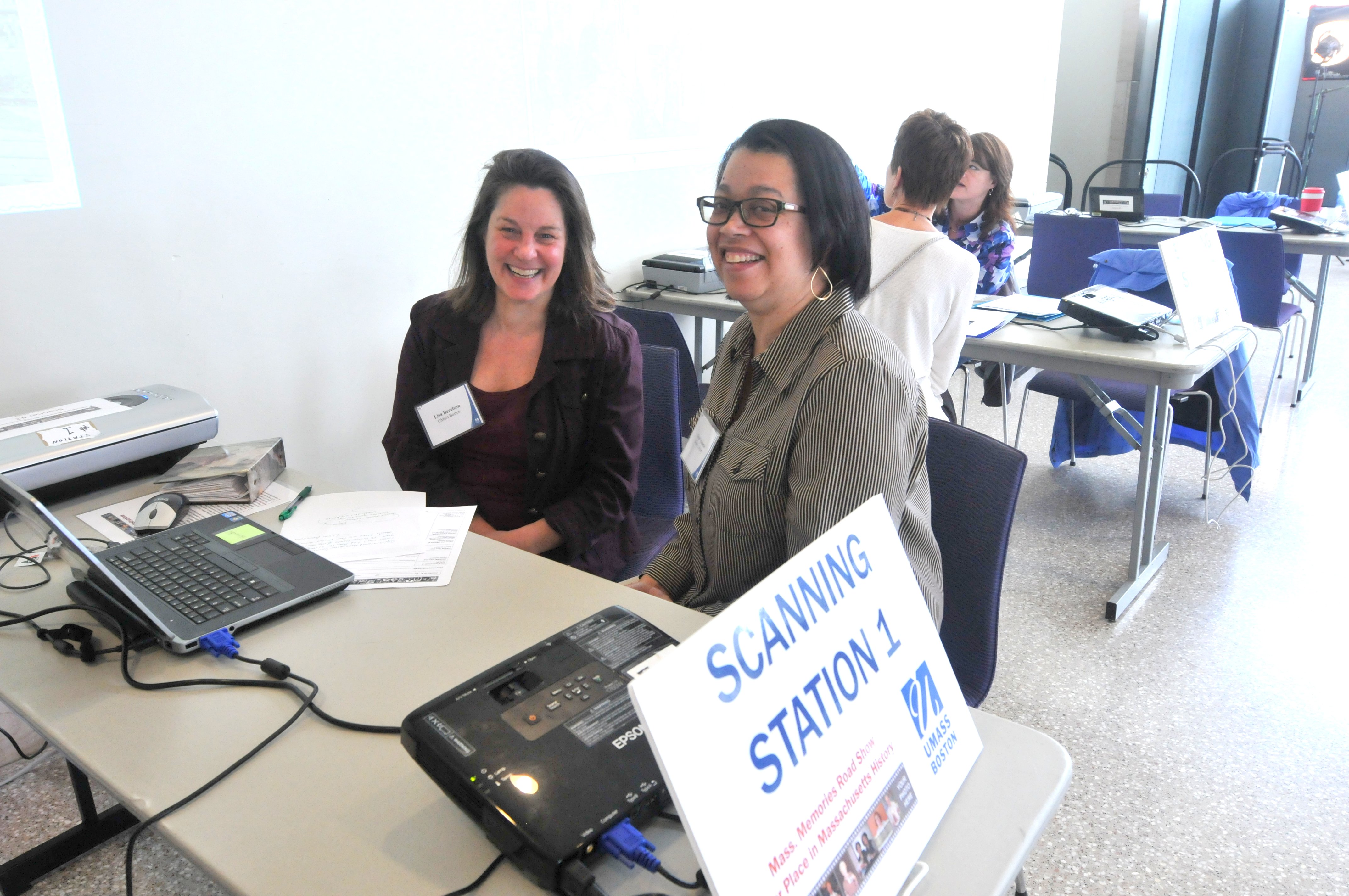 <p>Volunteers at the Scanning Station (also known as the Copying Station) at the UMass Boston Mass. Memories Road Show, 2014</p>
